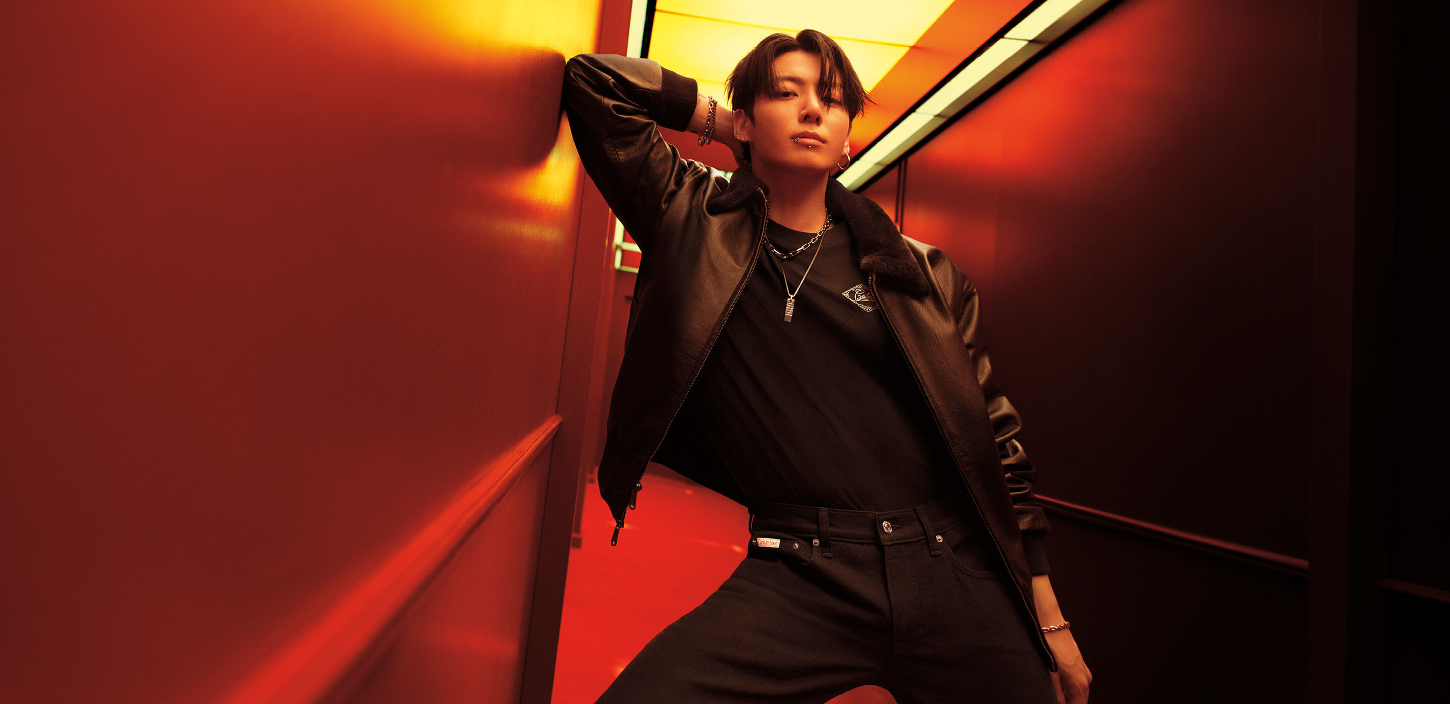 Calvin Klein Jung Kook Heats Up Full denim with a 90s edge. The denim worn low to show off the iconic logo waistband